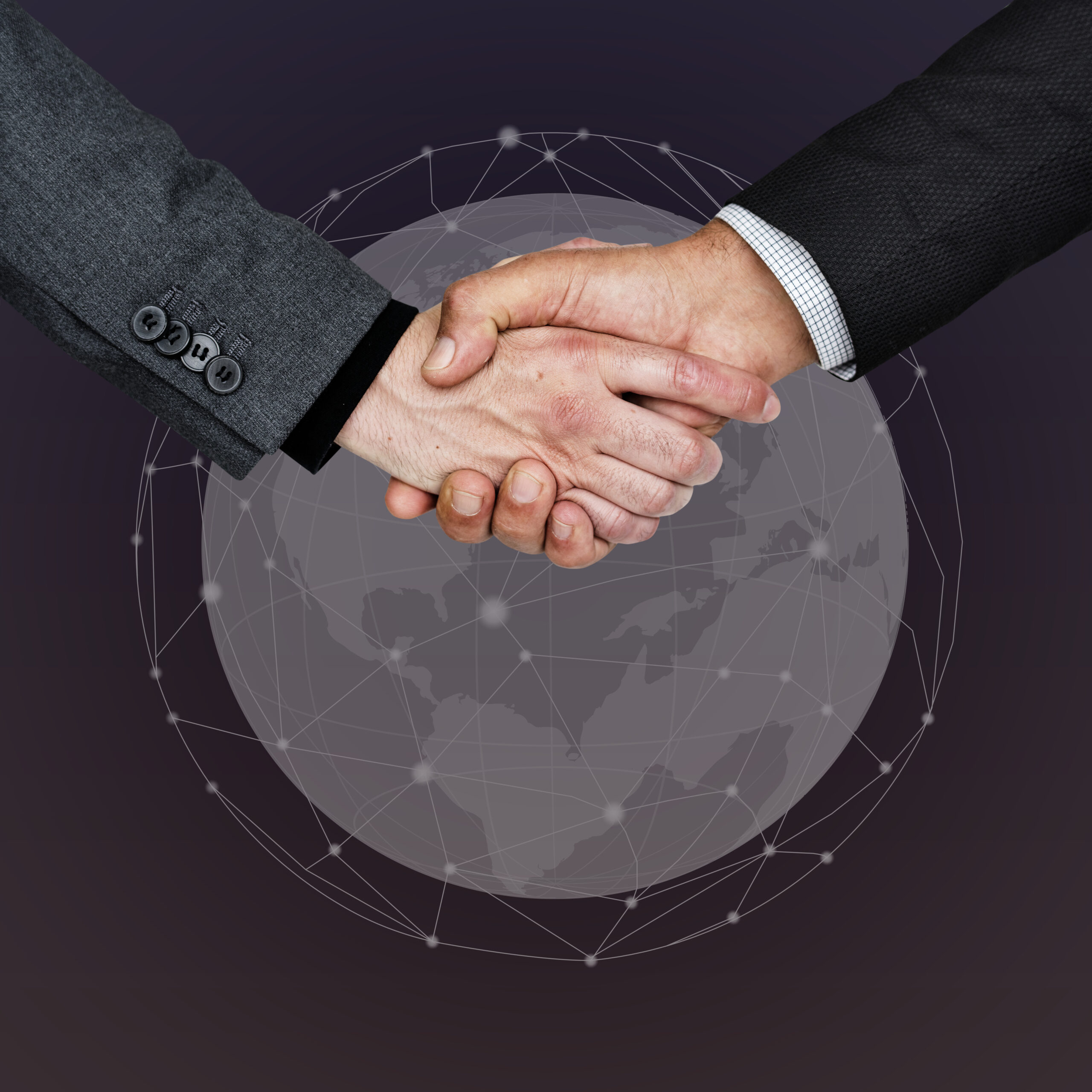 Business people shaking their hands